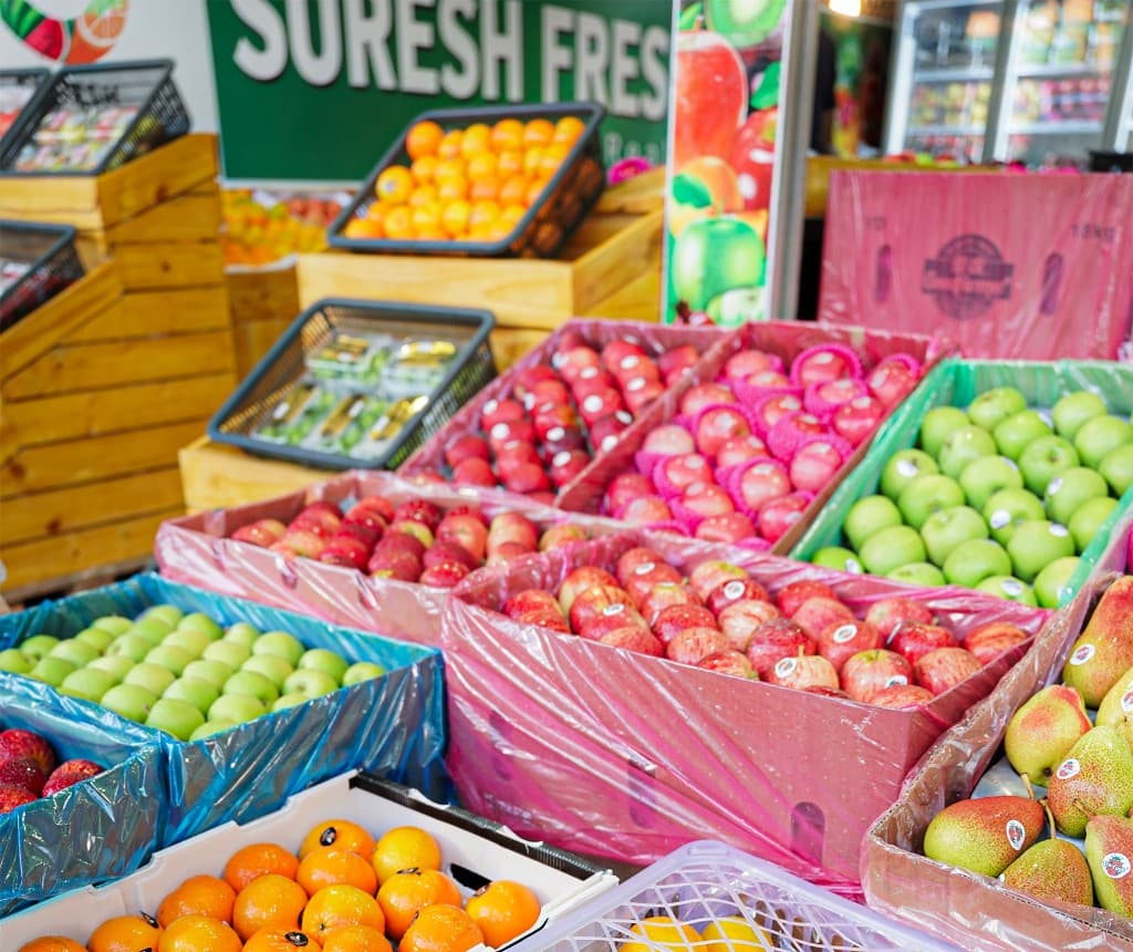 Fresh apples, oranges and pears displayed at the Suresh Fresh Fruit market stall